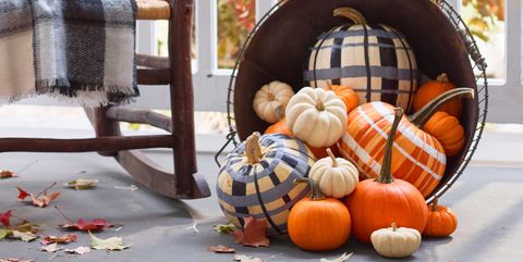 pumpkin painting ideas plaid painted pumpkins in a basket on a porch