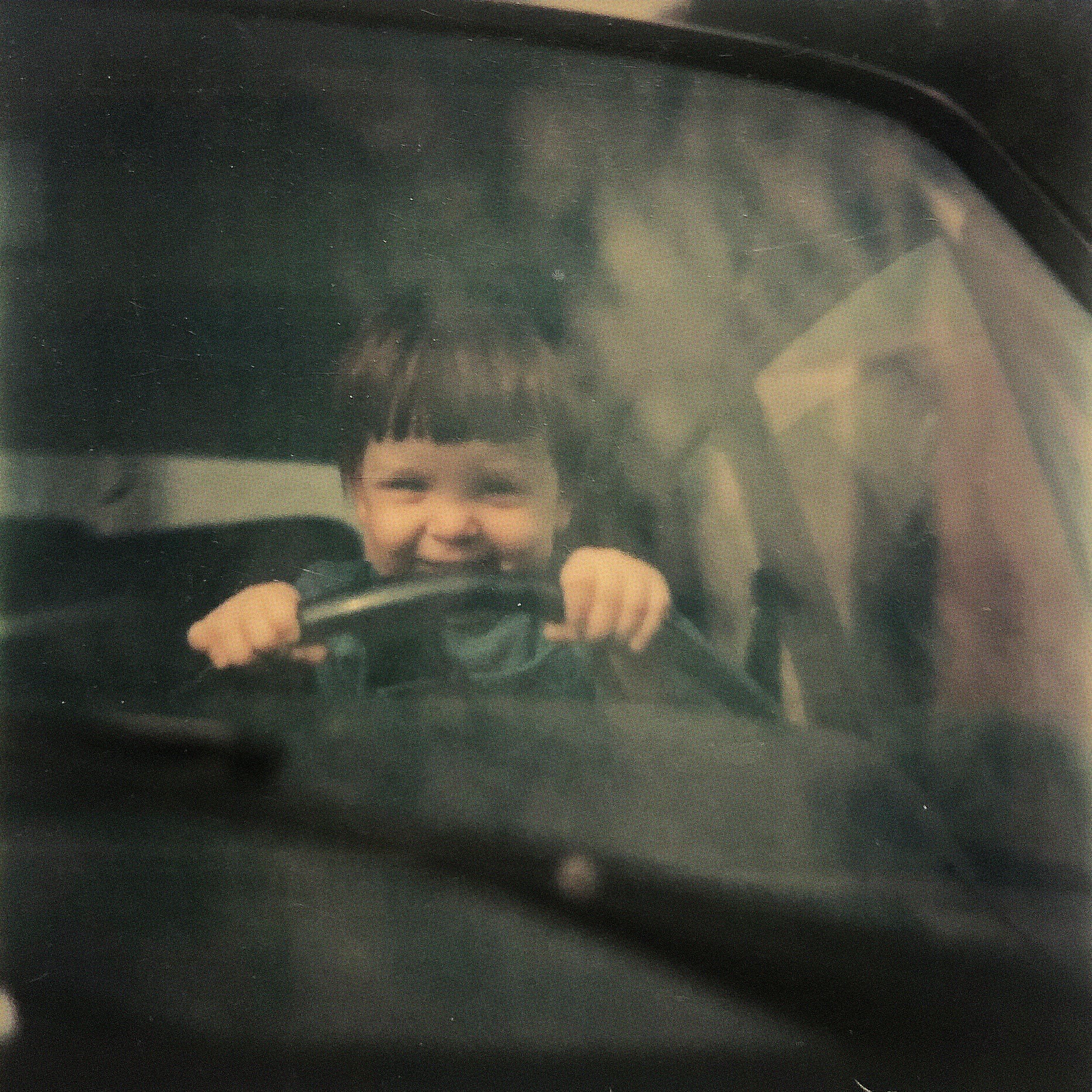 child playing with cars