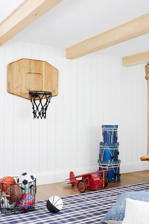 Basketball hoop, Floor, Ceiling, Hardwood, Net, Light fixture, Basketball, Baggage, Religious item, Symbol, 