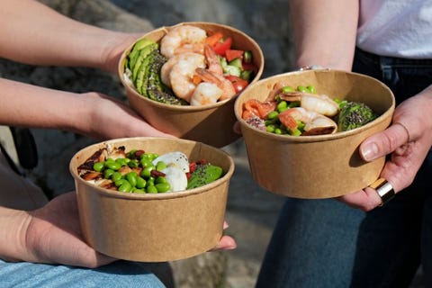 Poke bowls in takeout boxes. poke bowls in takeout boxes