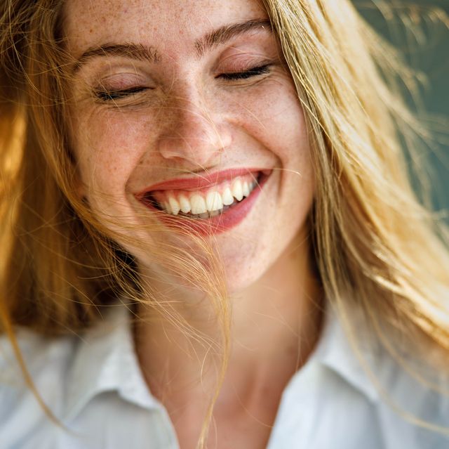 portrait of a young happy redhead woman