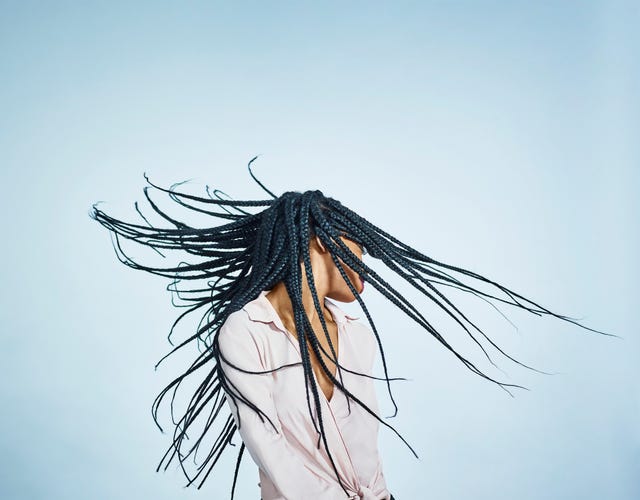 portrait of black female flicking hair