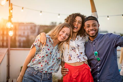 portrait of friends enjoying in terrace party