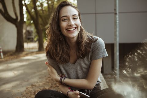 portrait of happy young woman outdoors