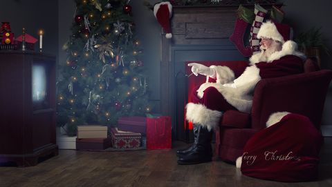 portrait of the real santa claus watching tv