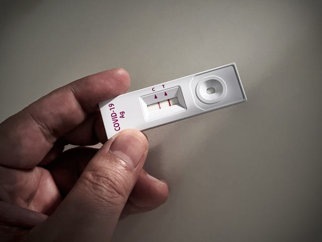 Positive test result shown on a Coronavirus Covid-19 or SARS CoV-2 Test on home test kit positive test result shown on a coronavirus covid19 or sars cov2 test on home test kit