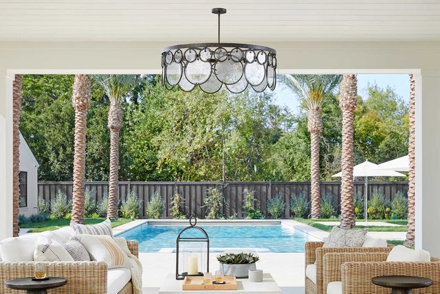patio furniture outside on next to a pool