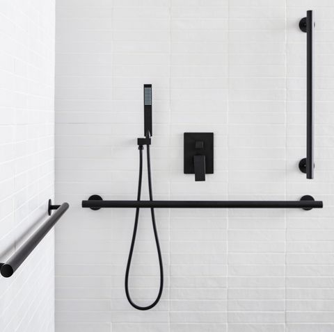 matte black grab bars in bathroom shower, two horizontal and one vertical