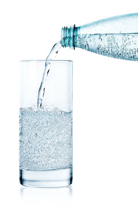 pouring sparkling water in a glass