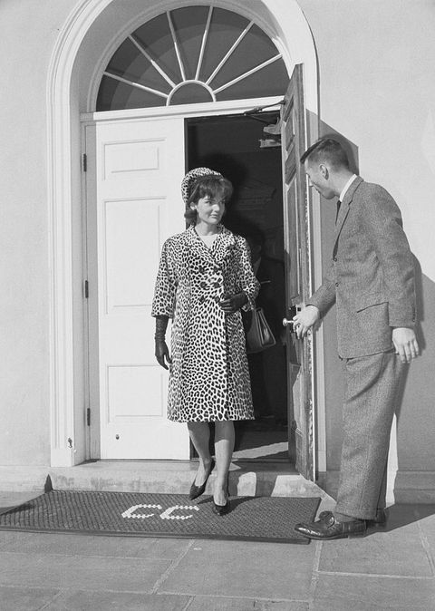 man holding door for mrs jacqueline kennedy