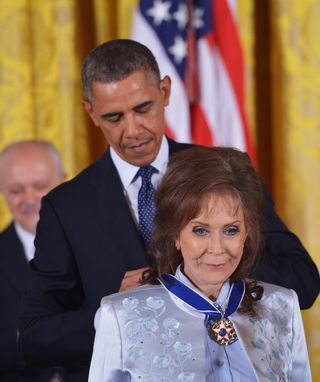 president obama awards the medal of freedom to loretta lynn in the east room of the white house