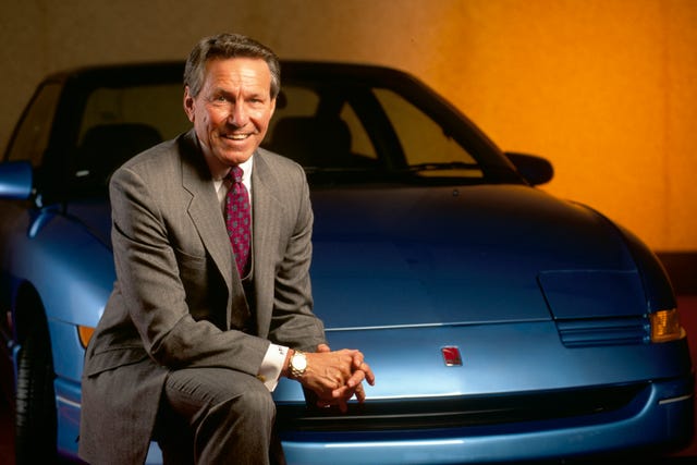 Lloyd Reuss with Saturn Car lloyd reuss with saturn car