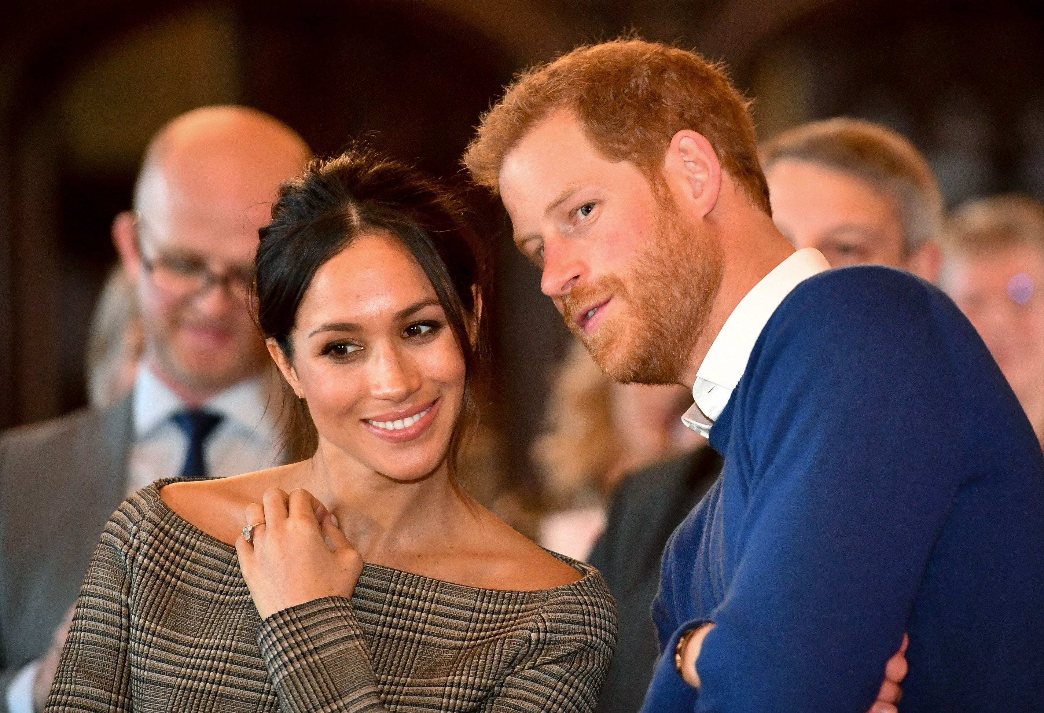 prince harry whispers to meghan markle as they watch a news photo 906665892 1564735753 Lorie