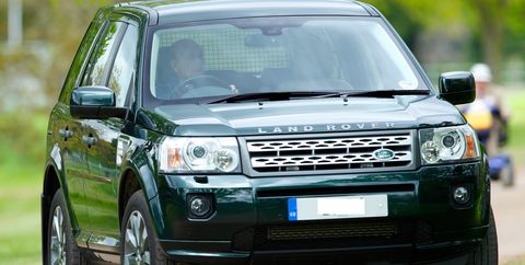 Prince Philip is shown driving his Land Rover Freelander in 2013.