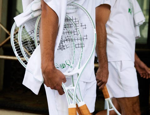 person holding tennis racquets