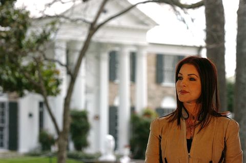 Memphis, Tennessee March 27 Priscilla Presley listens to Home Secretary Gail Norton address a group of Elvis fans in the front lawn at Graceland March 27, 2006 in Memphis, Tennessee Graceland, the former home of the king of rock and roll, Elvis Presley, has been designated a National Historic Landmark, bearing less From 2500 Historic Places Title photo by Mike Browngetty Images
