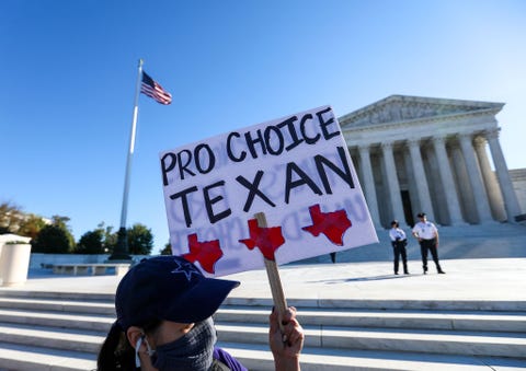 someone holding a sign that reads pro choice texan outside the supreme court