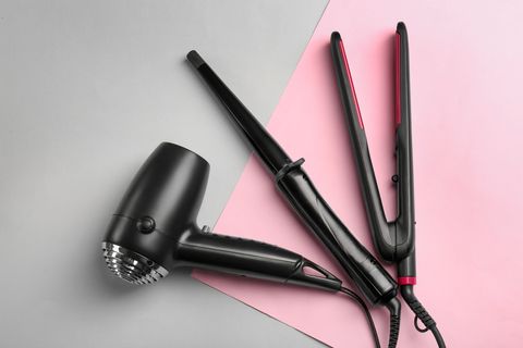 professional hairdresser's equipment on color background