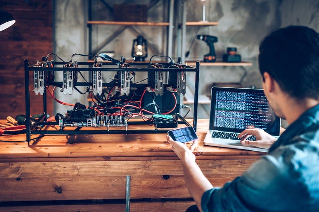 programmer preparing mining rig with gpu