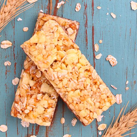 muesli bars with raisins and nuts on a blue background