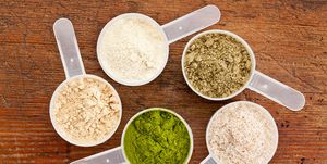 Five different scoops of protein powders