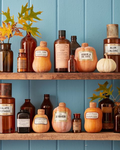 carved honeynut squash with cork stems and vintage apothecary labels mod podged to the front