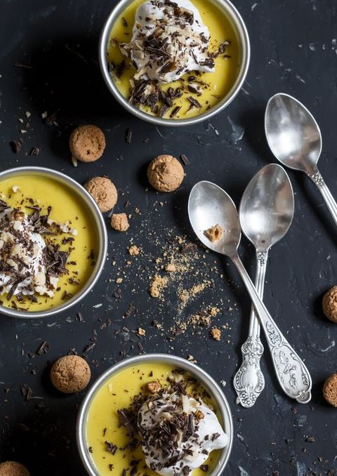 Pumpkin pudding, decorated with whipped cream, nuts and chocolate