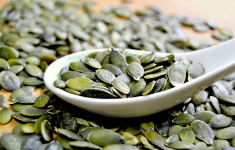 Pumpkin seeds on a spoon