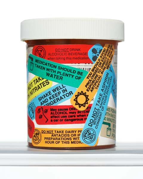 prescription medication with many stickers and various instructions