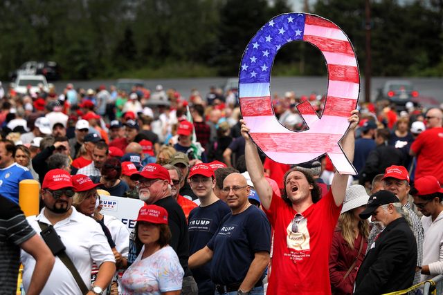 wilkes barre, pa   august 02 david reinert holds up a large "q" sign while waiting in line on august 2, 2018 at the mohegan sun arena at casey plaza in wilkes barre, pennsylvania to see president donald j trump at his rally "q" is a conspiracy theory group that has been seen at recent rallies    photo by rick loomisgetty images