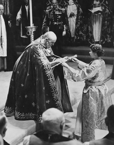 the archbishop of canterbury, geoffrey fisher, presents the queen with the sceptre at the coronation in 1953