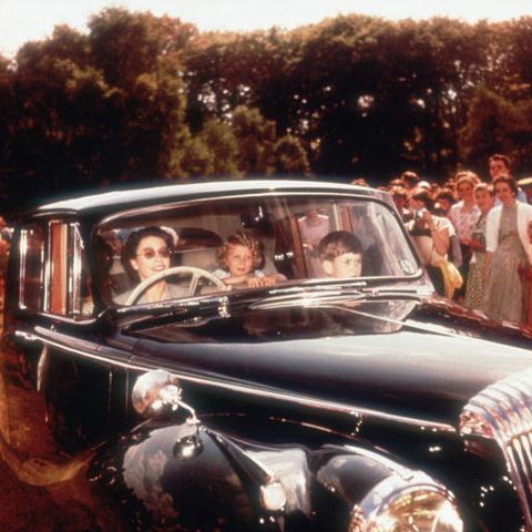 queen and children in daimler saloon car in 1957