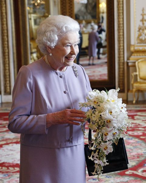 queen elizabeth ii presented with a replica of the coronation bouquet