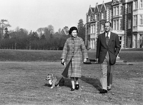 queen elizabeth and prince philip walk their corgi on the 30th anniversary of her reign