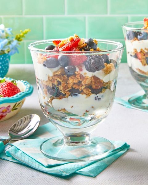 yogurt parfait with granola and berries in glass