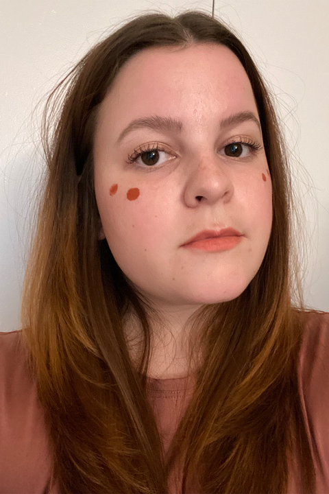 my face with two dots of rare beauty blush on each cheek