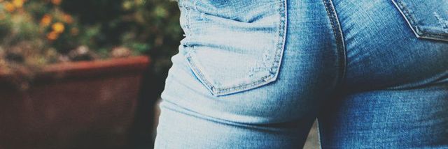 rear view young teen in blue jeans