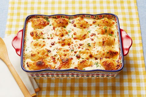 chicken alfredo stuffed shells on yellow checkered background