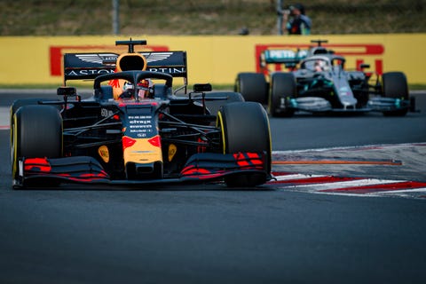 Red Bull Racings Dutch driver Max Verstappen (L) leads in...