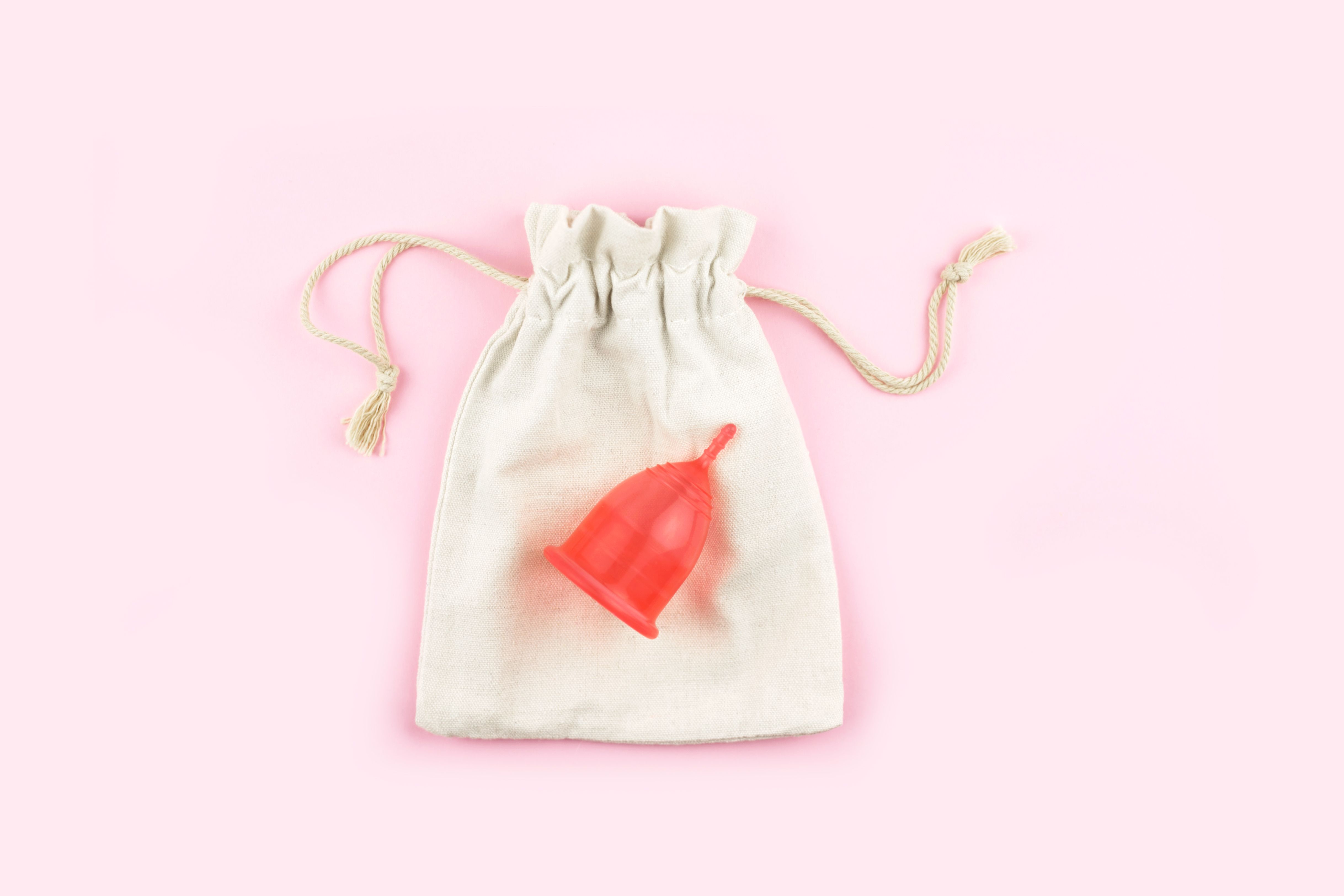 8 Best Menstrual Cups Of 2022 Gynecologist Recommended Menstrual Cups   Red Menstrual Cup On Cotton Bag On Pink Background Royalty Free Image 1645822539 