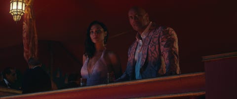 red notice l to r gal gadot as the bishop and  dwayne johnson as john hartley in red notice cr netflix © 2021