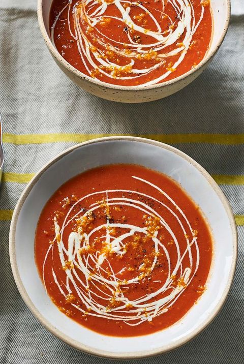 red pepper and tomato soup in blue ceramic bowl