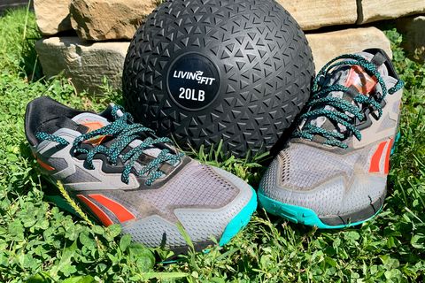 reebok nano x2 adventure shoes sitting in the grass with an exercise ball