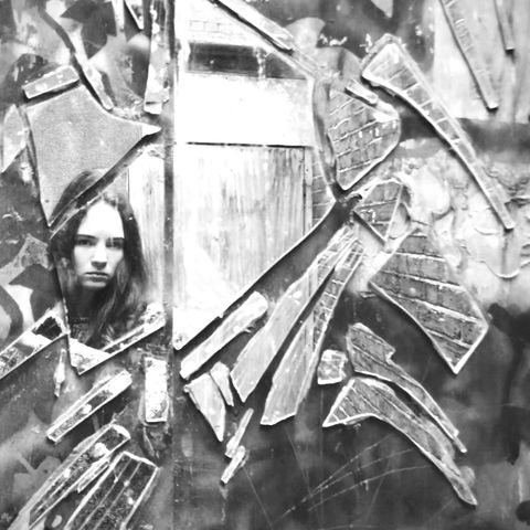 reflection of woman broken mirror