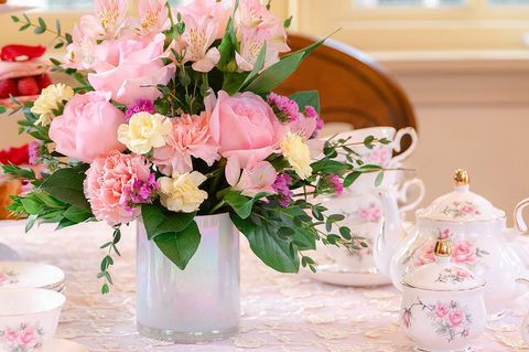 teleflora bouquet on table with tea set
