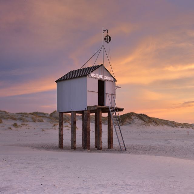 refuge hut on terschelling island in the netherlands at sunset
