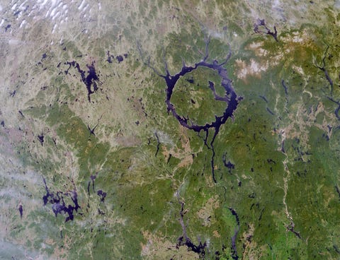 Remnants of one of the largest impact craters still preserved on the surface of the Earth. Occurring about 212 million years ago. Lake Manicouagan in northern Quebec, Canada. June 1, 2001.
