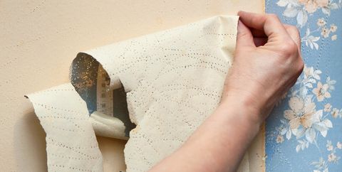 removing old wallpaper i royalty free image