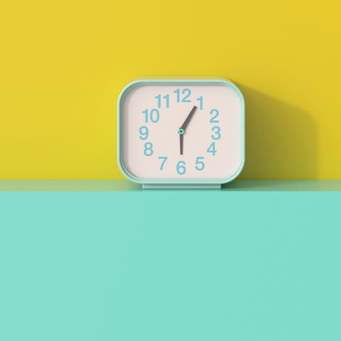 3D rendering, Alarm clock on shelf aggainst yellow background 3D rendering, Alarm clock on shelf aggainst yellow background