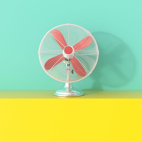 3D rendering, Fan on yellow shelf against green background 3D rendering, Fan on yellow shelf against green background